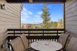 Enjoy breathtaking mountain views from this charming balcony.