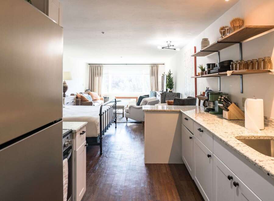 Discover the charm of this beautifully designed property, featuring a modern kitchen with granite countertops and ample storage.