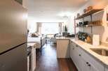 Discover the charm of this beautifully designed property, featuring a modern kitchen with granite countertops and ample storage.