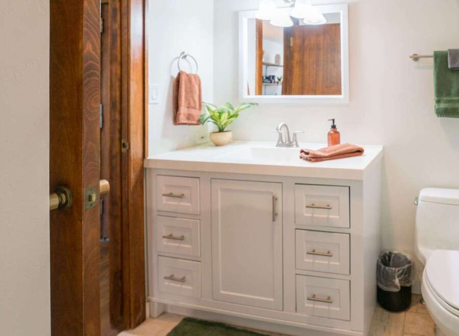 This charming bathroom features a bright and airy design, perfect for starting your day.