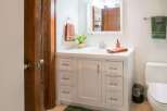 This charming bathroom features a bright and airy design, perfect for starting your day.