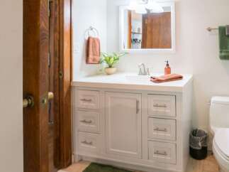 This charming bathroom features a bright and airy design, perfect for starting your day.