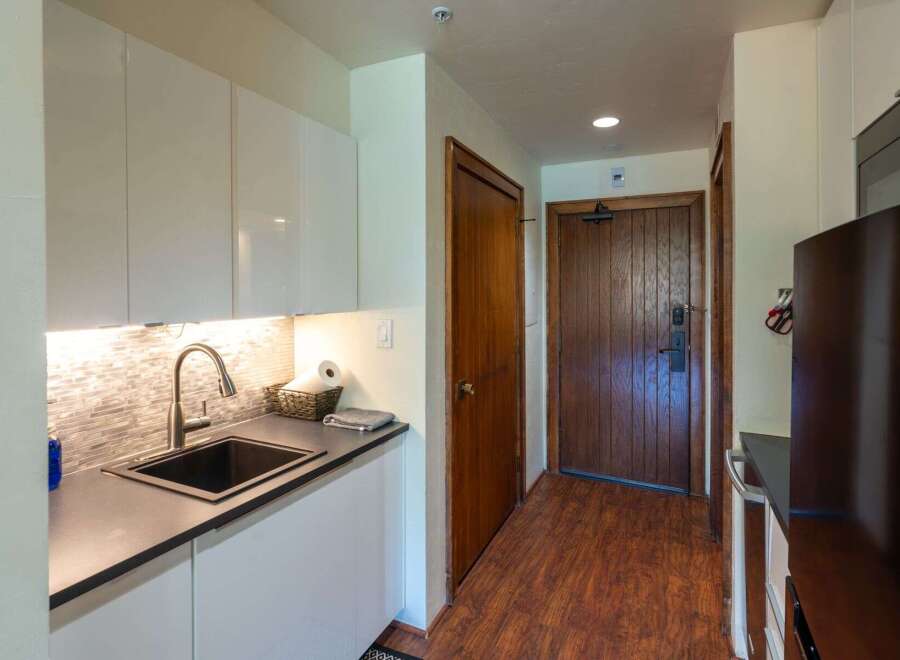 Step into this charming kitchen with sleek, modern cabinetry and a stylish backsplash.