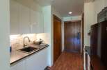 Step into this charming kitchen with sleek, modern cabinetry and a stylish backsplash.