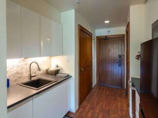 Step into this charming kitchen with sleek, modern cabinetry and a stylish backsplash.