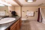 This charming bathroom features a classic design with a touch of rustic elegance.