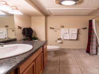 This charming bathroom features a classic design with a touch of rustic elegance.