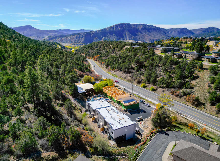 Discover new construction townhomes nestled in a scenic mountain landscape, offering a perfect blend of modern living and natural beauty.
