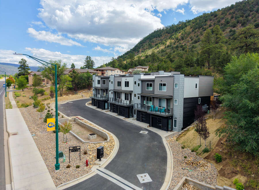 Discover modern living in this stunning townhome community nestled against a scenic hillside.