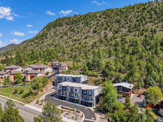 Discover modern living nestled against a scenic mountain backdrop.