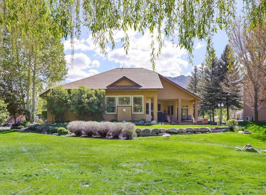 This stunning property boasts a beautifully landscaped backyard, perfect for outdoor entertaining.