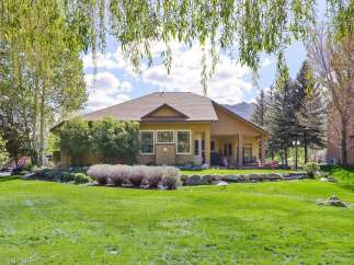 This stunning property boasts a beautifully landscaped backyard, perfect for outdoor entertaining.