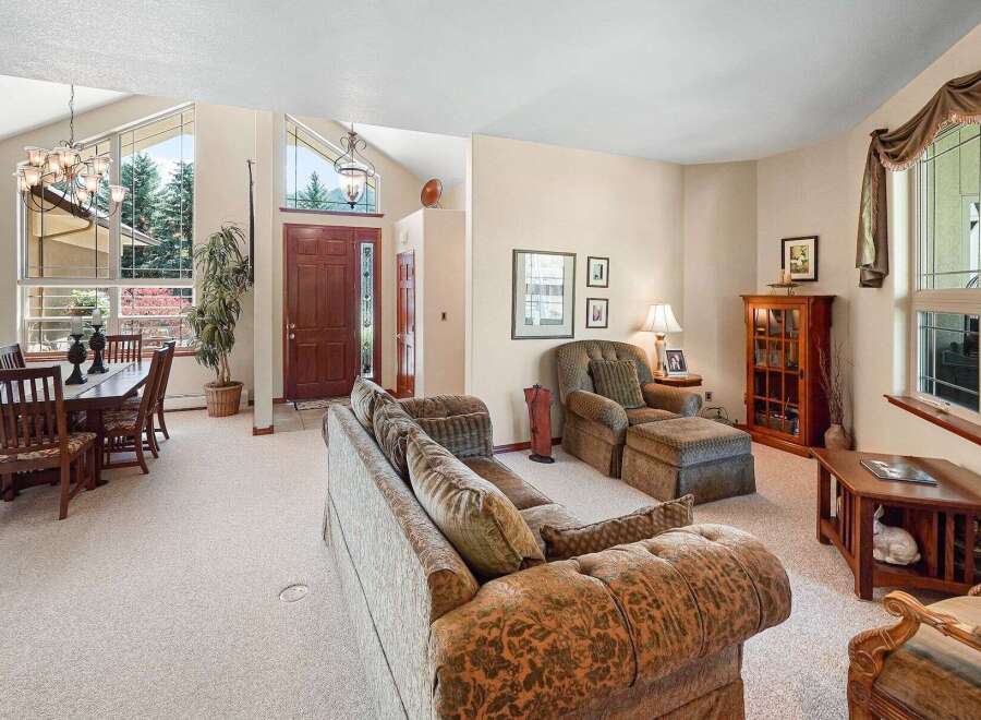 Step into luxury with this stunning property, featuring a spacious living area and a formal dining room.