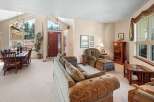 Step into luxury with this stunning property, featuring a spacious living area and a formal dining room.