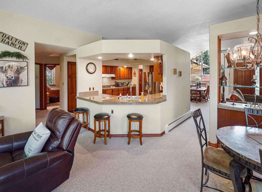 Step into this inviting home featuring a well-appointed kitchen with a breakfast bar, perfect for casual dining and entertaining.