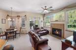 This stunning property boasts a cozy living room with a fireplace, perfect for relaxing evenings.