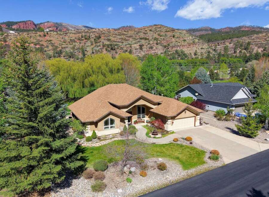 This stunning property boasts a beautifully designed home with a warm, inviting aesthetic.