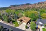 Discover a stunning home nestled in a picturesque setting, offering breathtaking views of the surrounding mountains and lush greenery.