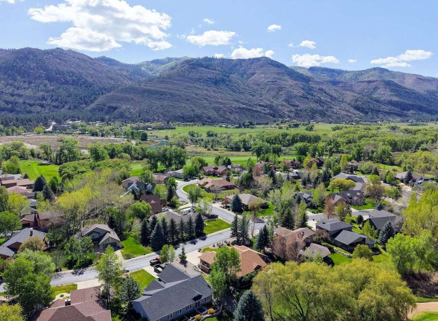 Discover your dream home in this stunning mountain community! This property boasts beautiful homes with lush landscaping and breathtaking mountain views.