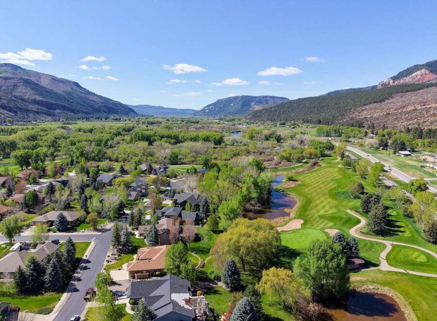 Discover your dream home in this stunning location! This property boasts breathtaking views of a lush golf course, serene river, and majestic mountains.