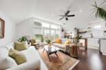 This stunning living space boasts a bright and airy atmosphere, perfect for relaxation and entertaining.