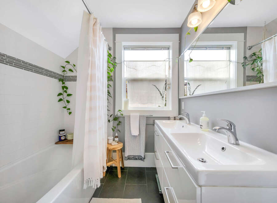 This charming bathroom features a modern design with a touch of nature.