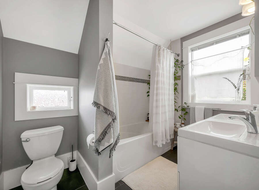 This charming bathroom features a modern design with a clean and inviting atmosphere.