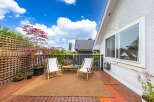 Enjoy the tranquility of this beautiful outdoor deck, perfect for relaxation and entertaining.