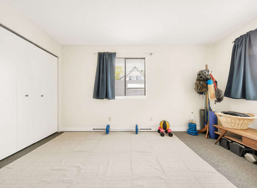 This versatile space is perfect for a home gym or fitness area.