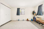 This versatile space is perfect for a home gym or fitness area.