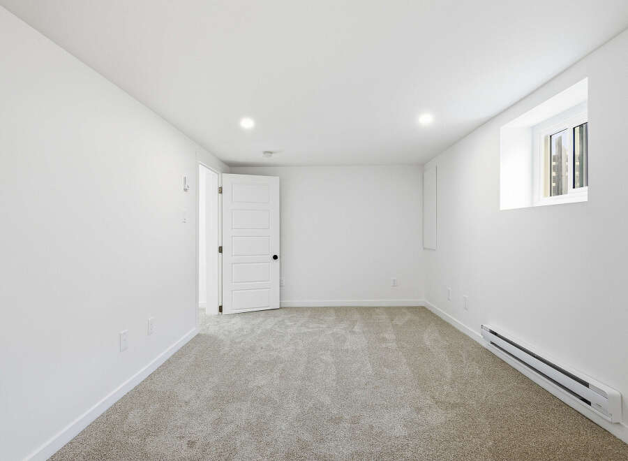 Discover the potential of this bright and airy room, perfect for a bedroom or home office.