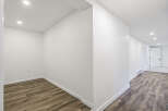 Discover the potential of this beautifully designed space! Featuring a modern aesthetic with pristine white walls and recessed lighting, this area offers a bright and inviting atmosphere.