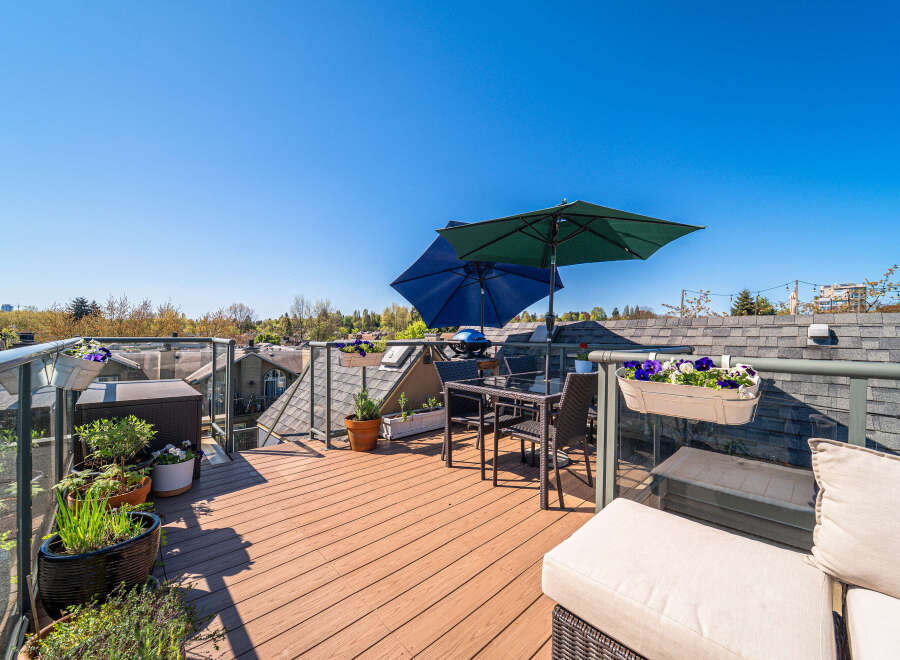Enjoy breathtaking views from this stunning rooftop terrace! This outdoor oasis features a stylish seating area, perfect for entertaining or relaxing.
