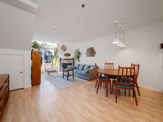 This stunning property boasts a bright and airy living space, perfect for modern living.