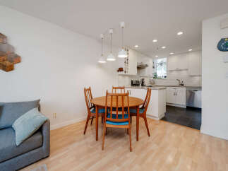 This charming property features a bright and airy dining area, perfect for entertaining or enjoying everyday meals.