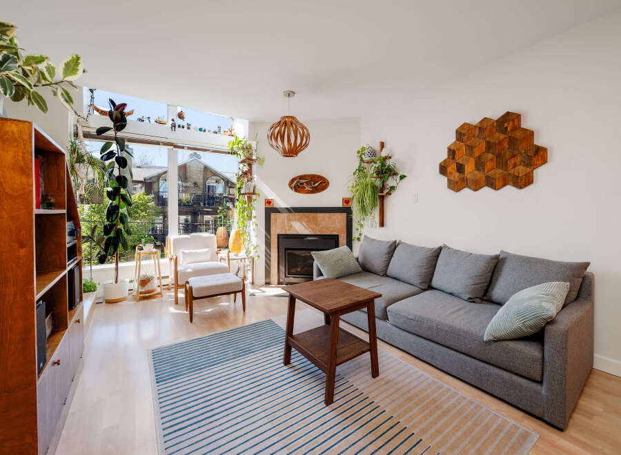 This stunning living room boasts a modern design with a cozy sectional sofa and a stylish coffee table.