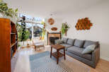 This stunning living room boasts a modern design with a cozy sectional sofa and a stylish coffee table.
