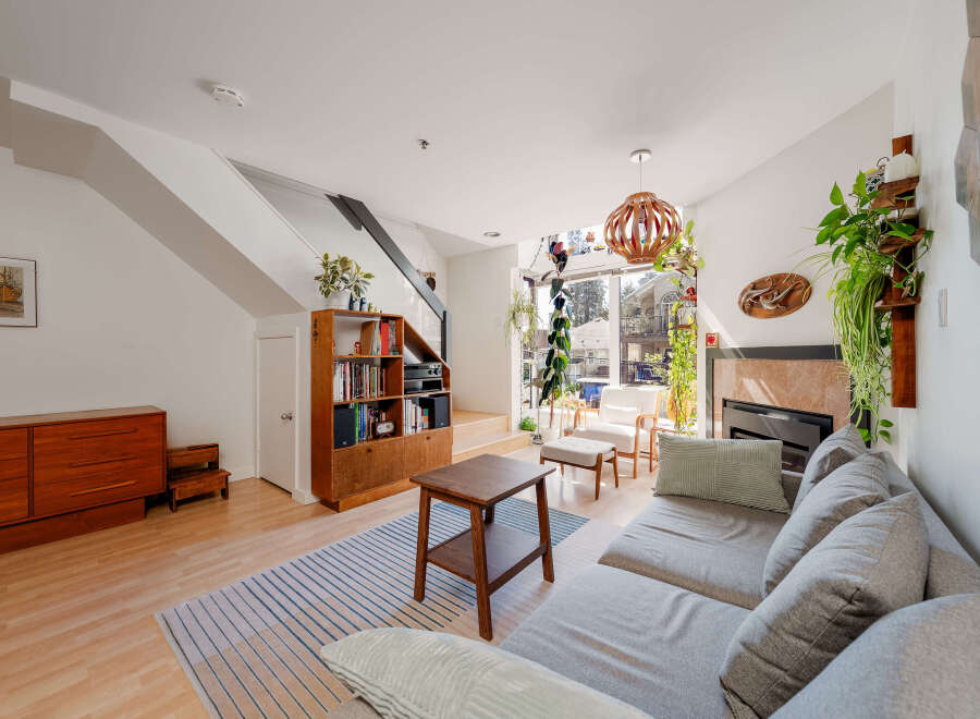 Step into this inviting living space, featuring a cozy fireplace and a stylish, modern design.