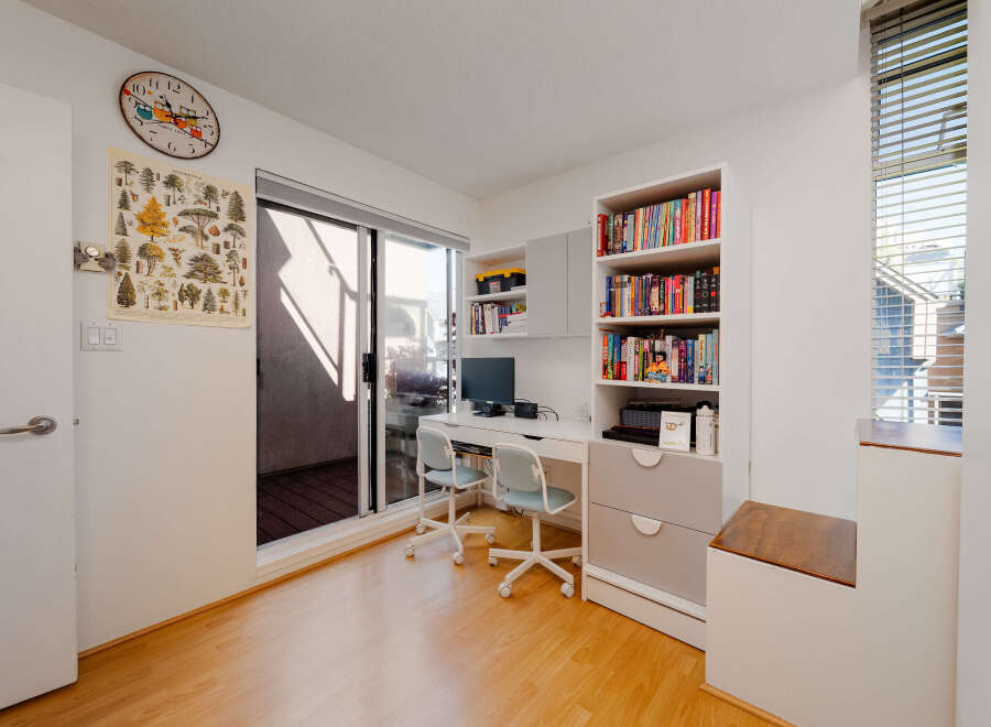 This bright and airy room offers a perfect blend of functionality and style, ideal for a home office or study space.