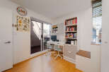 This bright and airy room offers a perfect blend of functionality and style, ideal for a home office or study space.