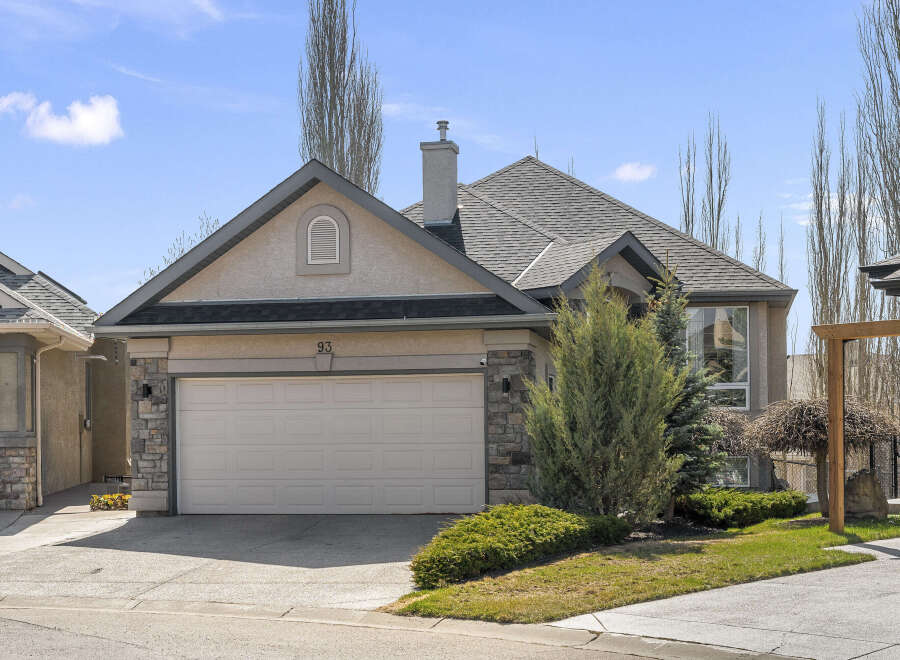 This stunning property boasts a beautiful exterior with a well-maintained lawn and lush landscaping.