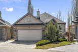 This stunning property boasts a beautiful exterior with a well-maintained lawn and lush landscaping.