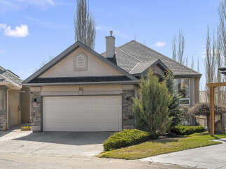This stunning property boasts a beautiful exterior with a well-maintained lawn and lush landscaping.