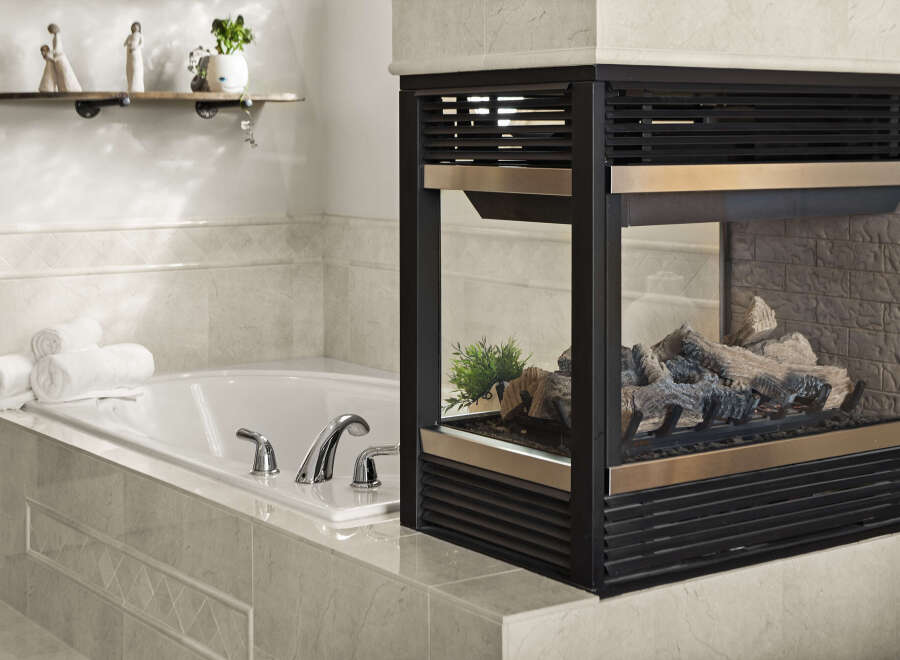 This luxurious bathroom features a modern fireplace, perfect for creating a cozy and inviting atmosphere.