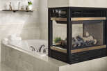 This luxurious bathroom features a modern fireplace, perfect for creating a cozy and inviting atmosphere.