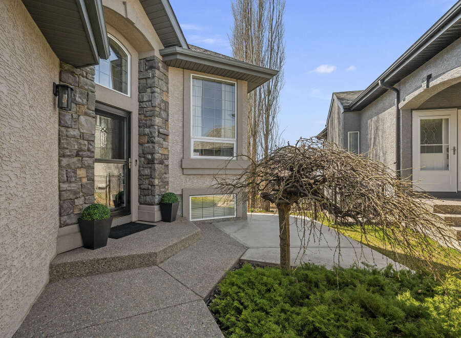 This stunning property boasts a beautifully designed exterior with a welcoming entrance.