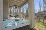 Enjoy the ultimate relaxation in this stunning outdoor oasis! This property features a luxurious hot tub, perfect for unwinding after a long day.