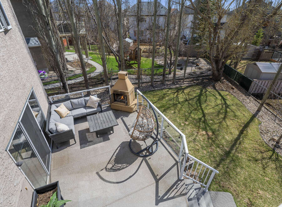Enjoy outdoor living at its finest with this stunning property featuring a spacious deck and a cozy fireplace.