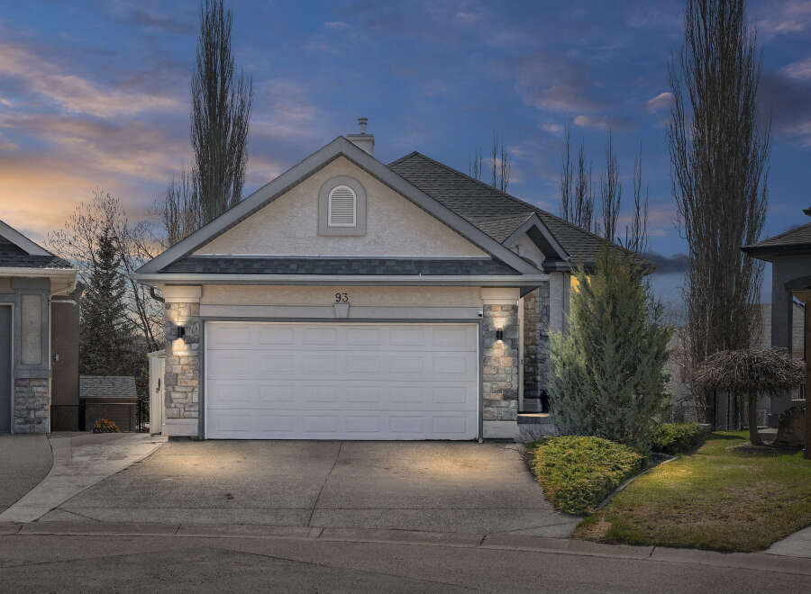 This stunning property boasts a modern facade with a spacious two-car garage, perfect for families.