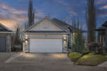 This stunning property boasts a modern facade with a spacious two-car garage, perfect for families.